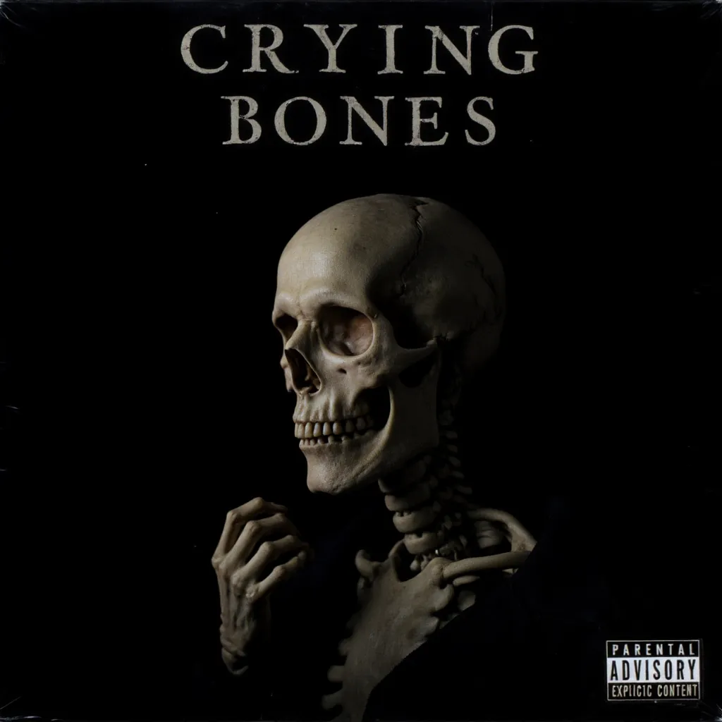 Album cover titled Crying Bones featuring a skeleton portrait with a single tear and a skeletal hand on a black background, including a parental advisory explicit content sticker.