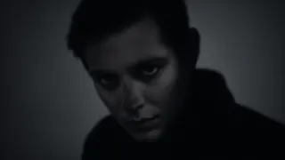 Dark chiaroscuro ghostly portrait of a person with intense, moody lighting and dramatic shadows creating a haunting atmosphere